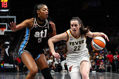 Caitlin Clark #22 of the Indiana Fever drives to the basket against Angel Reese #5 of the Atlanta Dream during the second quarter at State Farm Arena on June 20, 2026 in Atlanta, Georgia.