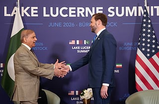 US Vice President JD Vance shakes hands with Pakistan's Prime Minister Shehbaz Sharif at the Burgenstock luxury hotel complex overlooking Lake Lucerne, Switzerland, on June 21, 2026.