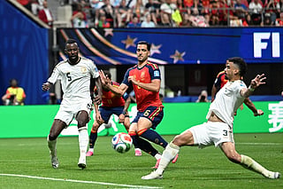 Saudi Arabia's defender #03 Ali Lajami (R) and Saudi Arabia's defender #05 Hassan Al-Tambakti (L) fights for the ball with Spain's midfielder #06 Mikel Merino (C) during the 2026 World Cup Group H football match between Spain and Saudi Arabia at the Atlanta Stadium in Atlanta on June 21, 2026.