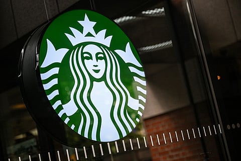 The logo of Starbucks coffee company is seen on a shop's window in Seoul on June 22, 2026.
