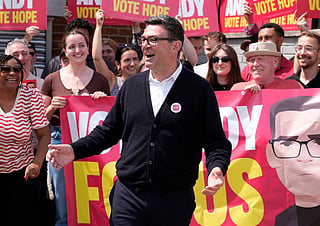 Andy Burnham is surrounded by supporters at the Stubshaw Cross Community and Sports Club in Ashton-in-Makerfield, England, on June 18, 2026 