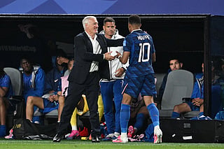 France's forward #10 Kylian Mbappe greets head coach Didier Deschamps after being substituted during the 2026 World Cup Group I football match between France and Iraq at the Philadelphia Stadium in Philadelphia on June 22, 2026.