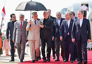 Pakistan's Prime Minister Shehbaz Sharif (third left), President Asif Ali Zardari (second right), Foreign Minister Ishaq Dar (second left) and Interior Minister Mohsin Naqvi (third right) walking alongside Iran's President Masoud Pezeshkian (centre) and Foreign Minister Abbas Araghchi (right) upon their arrival at the Nur Khan Air Base in Rawalpindi.  