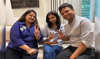 Avni with her parents. She  emerged as one of the country’s top performers after the review process revised her scores in English and Business Studies.