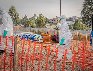 Healthcare workers carry on a stretcher a patient suffering from the Ebola virus disease from an ambulance at the Ebola Treatment Center (ETC) in Bunia, Ituri, in the east of the Democratic Republic of Congo.