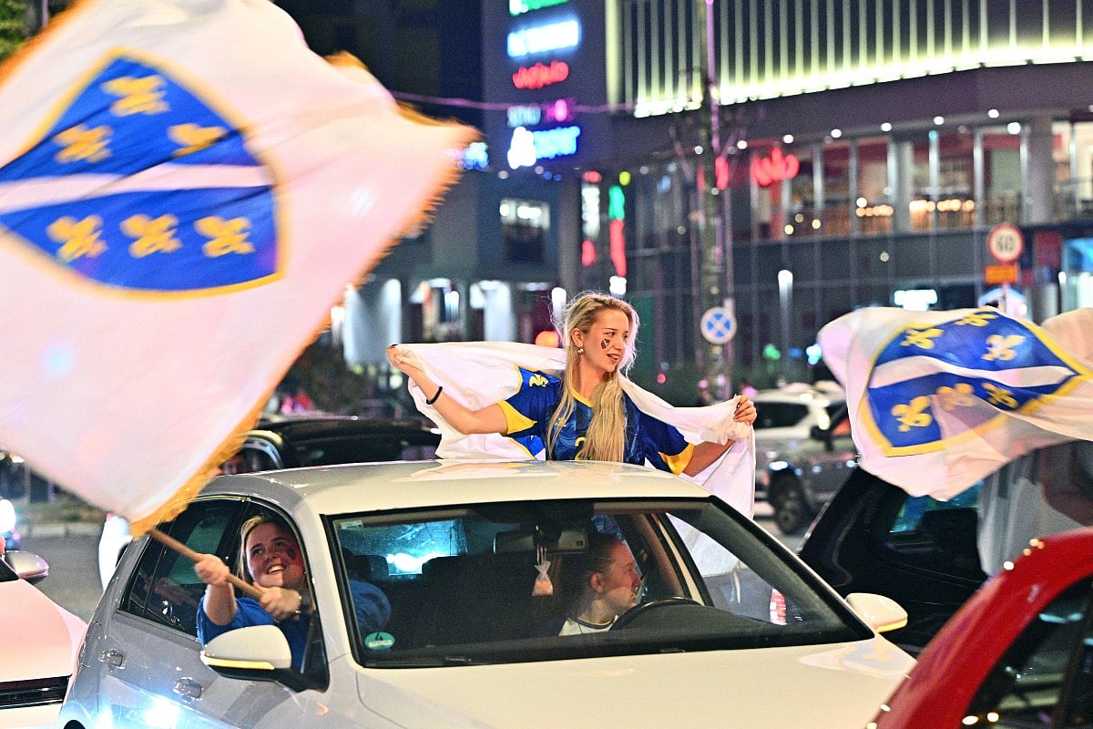 Bosnia and Herzegovina's supporters celebrate in the streets at the end of the Bosnia and Herzegovina World Cup 2026 football match against Qatar in Sarajevo on June 24, 2026.