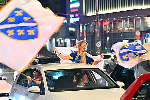 Bosnia and Herzegovina's supporters celebrate in the streets at the end of the Bosnia and Herzegovina World Cup 2026 football match against Qatar in Sarajevo on June 24, 2026.