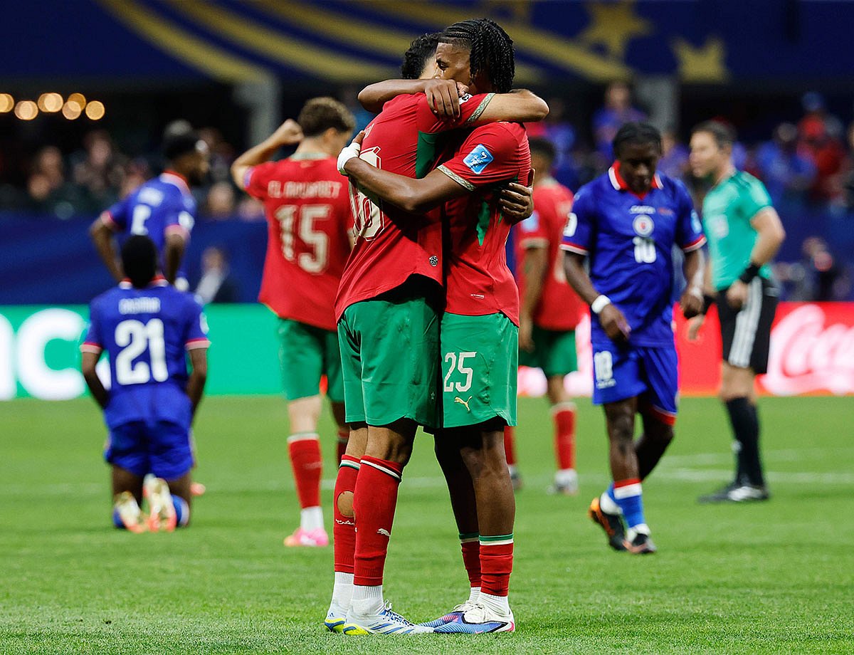 Morocco's Chadi Riad (18) and Redouane Halhal (25) celebrate the team's win during the World Cup Group C soccer match between Morocco and Haiti in Atlanta.