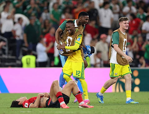  South Africa's forward #12 Thapelo Maseko celebrates with a temmate after the 1-0 victory in the 2026 World Cup Group A football match between South Africa and South Korea
