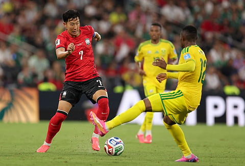 South Korea's forward #07 Son Heung-min and South Africa's forward #12 Thapelo Maseko fight for the ball during the 2026 World Cup Group A football match between South Africa and South Korea at the Monterrey Stadium in Guadalupe, Mexico, on June 24, 2026.