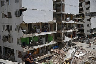 Graphic content / A view shows heavily damaged apartment buildings with exposed interiors amid rubble in Catia La Mar, La Guaira, Venezuela, on June 26, 2026, following earthquakes.