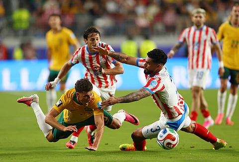 Ajdin Hrustic #10 of Australia competes for the ball against Omar Alderete #3 and Matias Galarza #23 of Paraguay during the FIFA World Cup 2026 Group D match at San Francisco Bay Area Stadium on June 25, 2026 in Santa Clara, California.