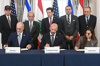US Secretary of State Marco Rubio (C, back) looks on as (L/R, front row) Israeli Ambassador to the US Yechiel Leiter, State Department Chief of Staff Daniel Holler, and Lebanese Ambassador to the US Nada Hamadeh sign a framework agreement at the US Department of State in Washington, DC, on June 26, 2026.
