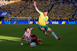 Australia's Aiden O'Neill (13) battles for the ball with Paraguay's Matias Galarza (23) during the World Cup Group D match in Santa Clara, California, on Thursday, June 25, 2026. 