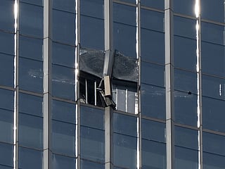 A damaged section is seen after a small plane crashed into the CITIC Tower, also known as China Zun, the tallest building in Beijing, on Saturday, June 27, 2026