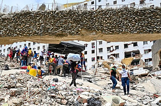 Volunteers work at the site of a collapsed building following earthquakes in Caraballeda, La Guaira state, Venezuela, on June 26, 2026.