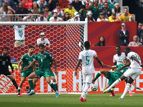 Senegal's midfielder #26 Pape Gueye scores his team's fouth goal during the 2026 World Cup Group I football match against Iraq at the Toronto Stadium in Toronto on June 26, 2026.