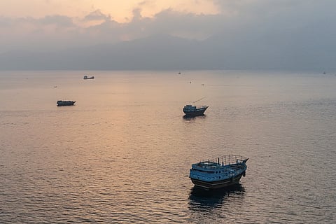 This aerial photograph shows boats anchored off Oman’s northern Musandam Peninsula near the Strait of Hormuz on June 27, 2026.