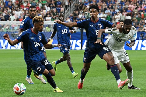 Cape Verde's defender #24 Wagner Pina (L) takes the ball as defender #08 Joao Paulo is challenged by Saudi Arabia's midfielder #23 Mohamed Kanno during the 2026 World Cup Group H football match at the Houston Stadium in Houston on June 26, 2026.