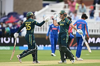 Australia's Georgia Wareham (L) and Australia's Ashleigh Gardner (R) celebrate after beating India in the ICC Women's T20 cricket world cup 2026 game between Australia and India, at Lord's in London on June 28, 2026.