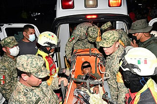 A handout photo released by the Mexican Army shows members of the “Yumare” Humanitarian Aid Group during the rescue of a nine year old boy in an area struck by twin earthquakes in La Guaira state, Venezuela, on June 28, 2026.