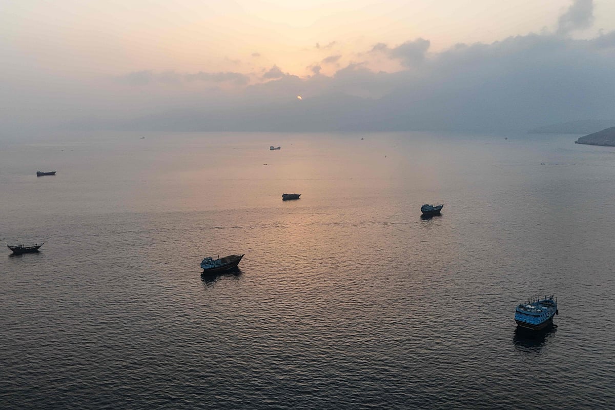 This aerial photograph shows boats anchored off Oman's northern Musandam Peninsula near the Strait of Hormuz on June 27, 2026. Iran launched attacks on US sites in the Gulf in response to American strikes on the country, state media said on June 27, after Washington accused Tehran of attacking one of its cargo ships in the Strait of Hormuz. The trading of fire raised questions about efforts to keep the crucial waterway open while Washington and Tehran negotiate a final settlement to a war that began on February 28 with US and Israeli strikes on Iran. 