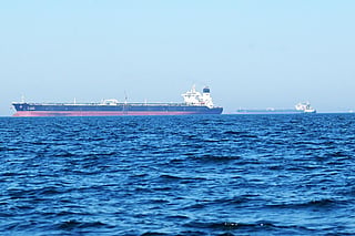 The 'Al-Riqqa' oil tanker (L) and 'Al-Yarmouk' oil tankers sail in the Arabian Gulf waters, off the coast of Kuwait City. File photo taken on June 27, 2026.