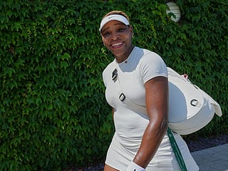 Serena Williams smiles after a training session at the All England Lawn Tennis and Croquet Club, ahead of the Wimbledon Championships in London. 