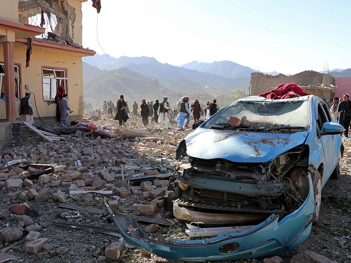 Afghan residents look at the remains of a building damaged in a Pakistani airstrike at a village in Tsamkani district of Afghanistan's Paktia province on June 29, 2026.