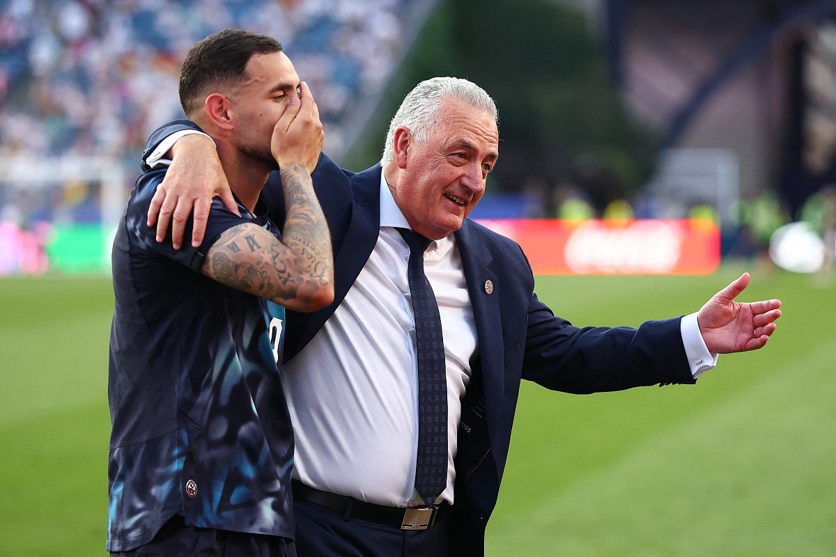 Gustavo Alfaro, Head Coach of Paraguay, embraces Gustavo Velazquez #2 after the penalty shootout win during the FIFA World Cup 2026 Round Of 32 match between Germany and Paraguay at Boston Stadium on June 29, 2026 in Foxborough, Massachusetts.