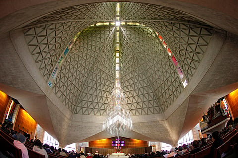 FILE - Parishioners attend a service at St. Mary's Cathedral, the mother church of the archdiocese in San Francisco, on April 2, 2010.