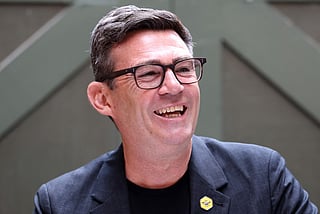 Labour MP and challenger for Leader of the Labour party, Andy Burnham, laughs as he delivers a speech in Manchester, northern England, on June 29, 2026.