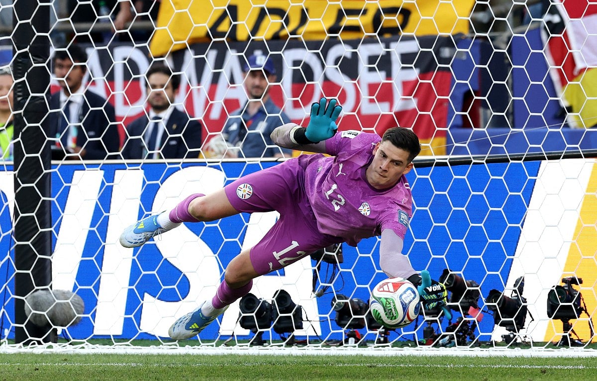 Orlando Gill of Paraguay saves the Germany's fourth penalty taken by Nick Woltemade of Germany during the penalty shootout.