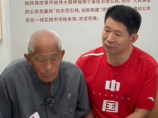 Lei with his elderly father at the reunion and press conference. 
