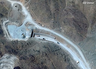 This handout satellite image courtesy of Vantor shows vehicles at the western entrance of the Pickaxe Mountain tunnel complex adjacent to the Natanz Nuclear Facility near Natanz, Isfahan province, central Iran, on June 21, 2026.