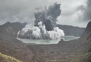 Steam and ash rise from the main crater of Taal Volcano during a phreatomagmatic eruption in Batangas province, south of Manila, on Tuesday. Authorities reminded the public that Taal Volcano Island remains under a Permanent Danger Zone designation, prohibiting permanent habitation and advising against entering or staying on the island and within the crater area due to continuing volcanic hazards.