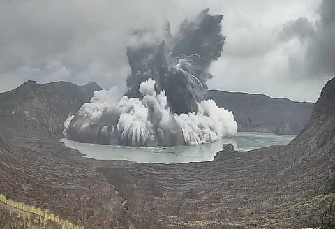 Steam and ash rise from the main crater of Taal Volcano during a phreatomagmatic eruption in Batangas province, south of Manila, on Tuesday. Authorities reminded the public that Taal Volcano Island remains under a Permanent Danger Zone designation, prohibiting permanent habitation and advising against entering or staying on the island and within the crater area due to continuing volcanic hazards.