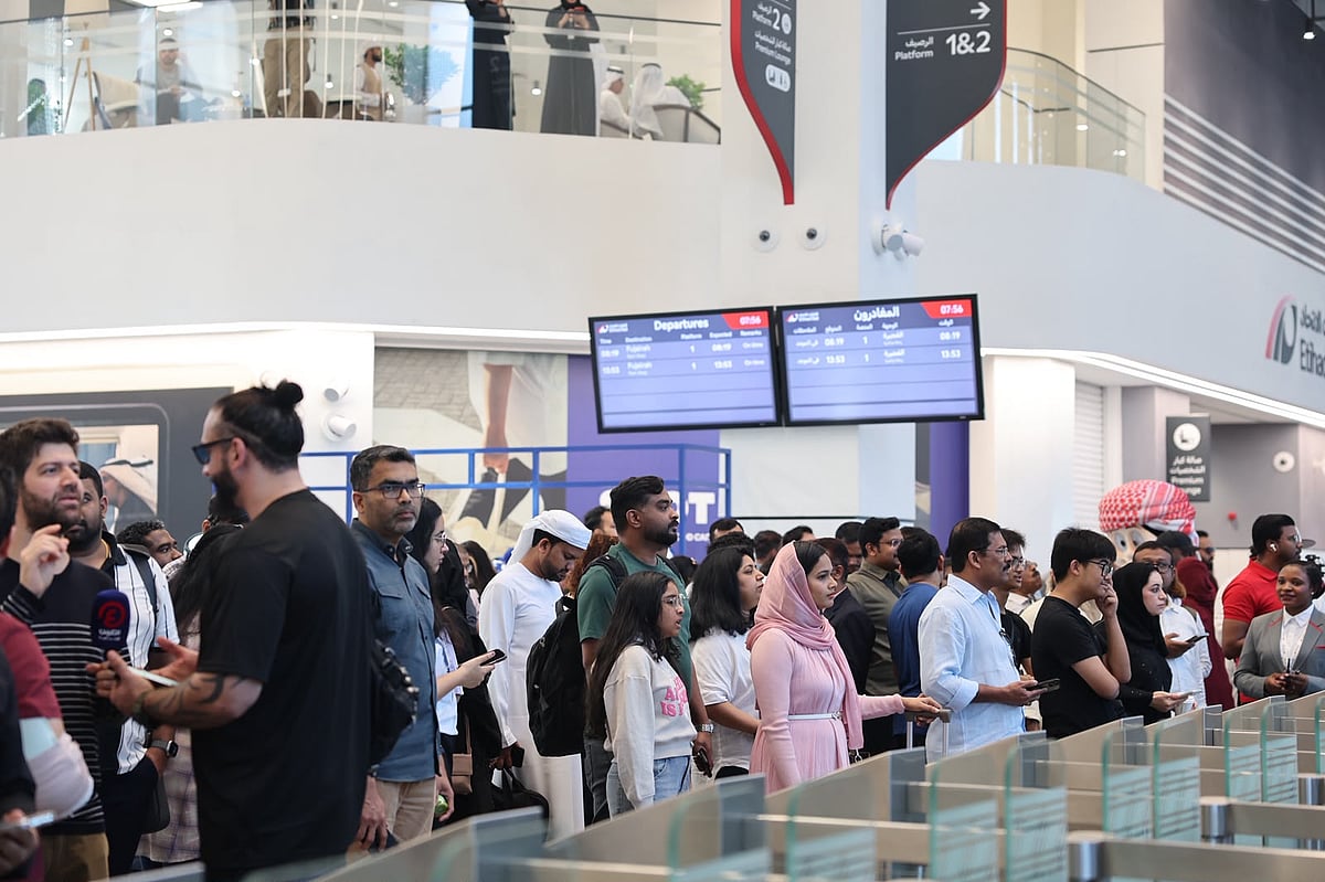 Passengers gather at Abu Dhabi's Mohammed Bin Zayed City Station on June 30.