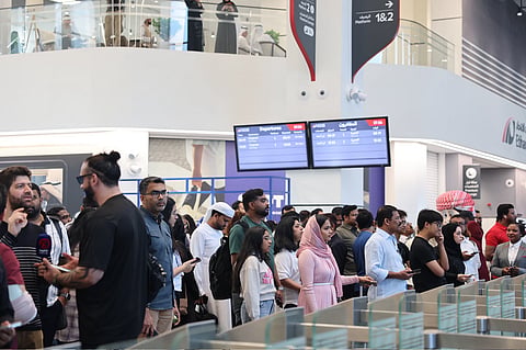 Passengers gather at Abu Dhabi's Mohammed Bin Zayed City Station on June 30.