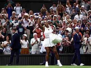 Serena Williams waves as he leaves the court after being defeated by Australia's Maya Joint during their women's singles first round tennis match on the second day of the 2026 Wimbledon Championships in London on June 30, 2026.
