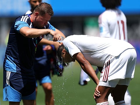 Miguel Pedro of Qatar is cooled down with water during the hydration break during the FIFA World Cup 2026 Group B match between Bosnia and Herzegovina and Qatar at Seattle Stadium on June 24, 2026 in Seattle, Washington.