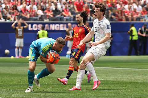 Spain's goalkeeper #23 Unai Simon (L) saves the ball during the 2026 World Cup round of 32 football match between Spain and Austria at the Los Angeles Stadium in Inglewood on July 2, 2026.
