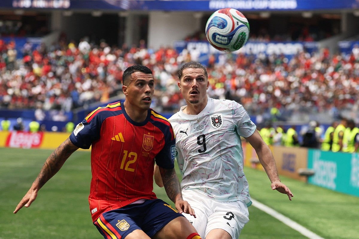 Spain's defender #12 Pedro Porro and Austria's midfielder #09 Marcel Sabitzer fight for the ball during the 2026 World Cup round of 32 football match between Spain and Austria at the Los Angeles Stadium in Inglewood on July 2, 2026.