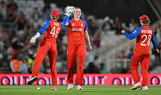 England's Lauren Bell celebrates taking the wicket of South Africa's Ayabonga Khaka for one run during the ICC Women's Twenty20 (T20) cricket world cup 2026 semi-final game between England and South Africa, at The Oval in London on July 2, 2026.