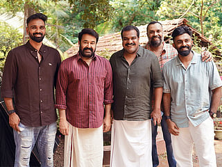Mohanlal with director Dileesh Pothan and other crew members of the film titled 'Nedumkandam Miracle'.