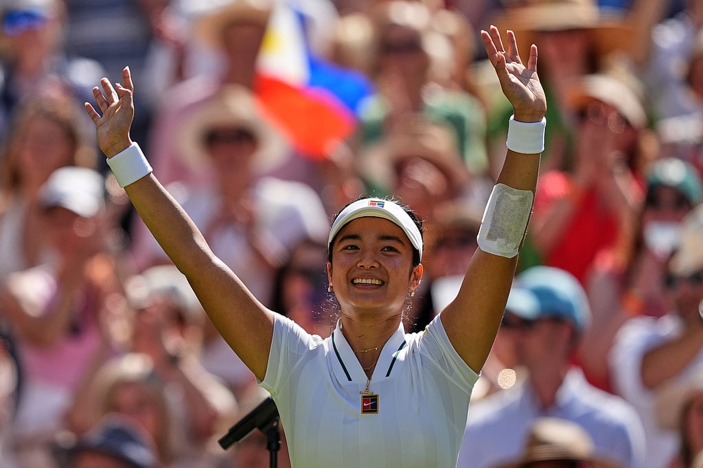 Alexandra Eala of the Philippines celebrates winning the third round women's singles match against Iga Swiatek of Poland at the Wimbledon Tennis Championships in London, Saturday, July 4, 2026.(AP Photo/Maja Smiejkowska)