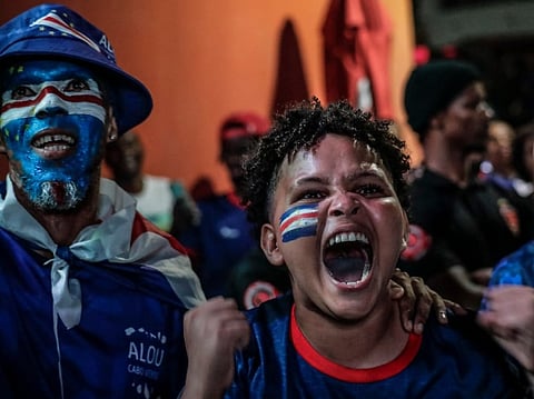 Supporters of Cape Verde’s national football team celebrate their first goal during the 2026 World Cup round of 32 football match against Argentina in Praia on July 3, 2026.