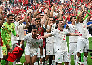 Morocco's forward #09 Soufiane Rahimi (bottom L), Morocco's forward #10 Brahim Diaz and teammates celebrate after winning the 2026 World Cup round of 16 football match between Canada and Morocco at the Houston Stadium in Houston on July 4, 2026.