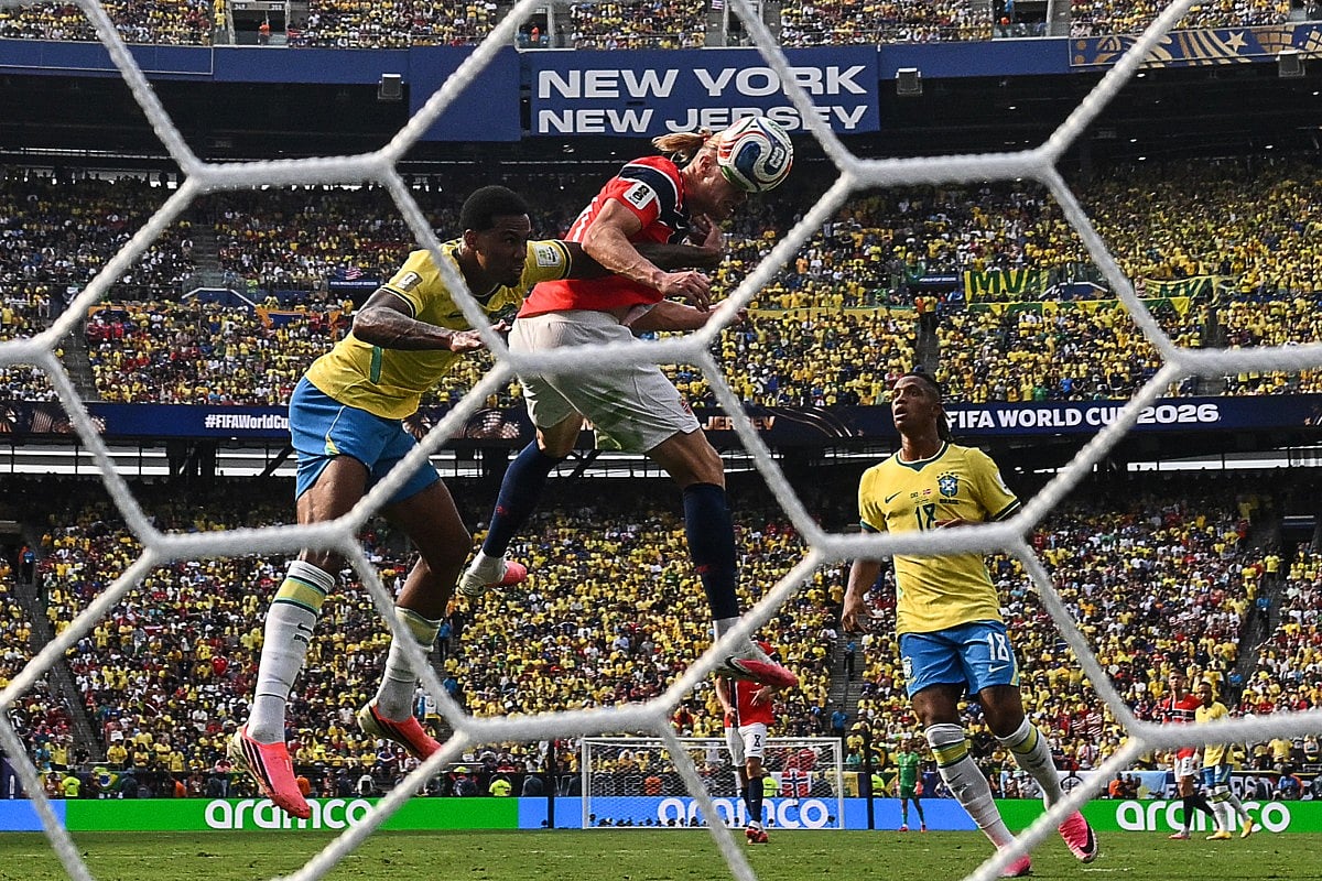 Norway's Erling Haaland heads the ball and scores the opening goal during the 2026 World Cup round of 16 football match between Brazil and Norway at the New York/New Jersey Stadium in East Rutherford on July 5, 2026.