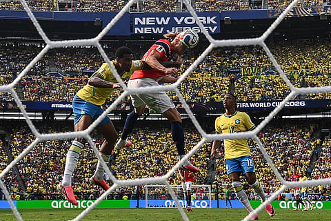 Norway's Erling Haaland heads the ball and scores the opening goal during the 2026 World Cup round of 16 football match between Brazil and Norway at the New York/New Jersey Stadium in East Rutherford on July 5, 2026.